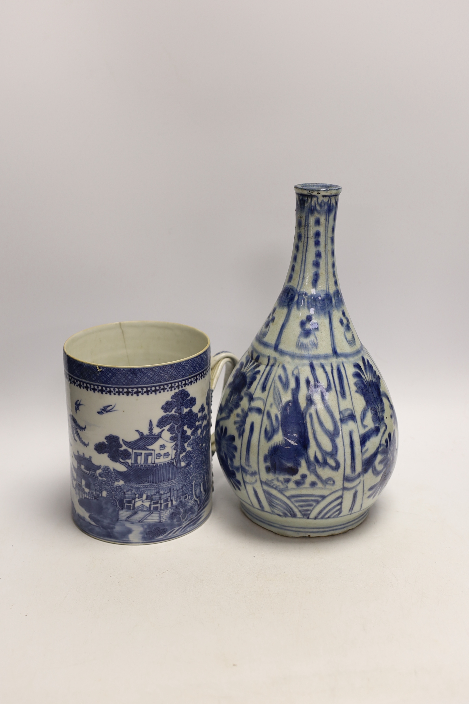 An 18th century Chinese export mug and a Chinese late Ming blue and white bottle vase, vase 29cm